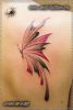 Фото татуировки - бабочка. Женская цветная тату на лопатке.