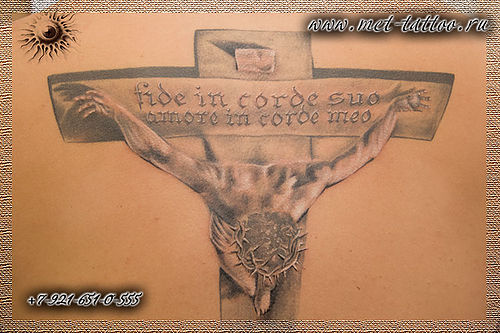 Фото татуировки по мотивам распятия Сальвадора Дали.